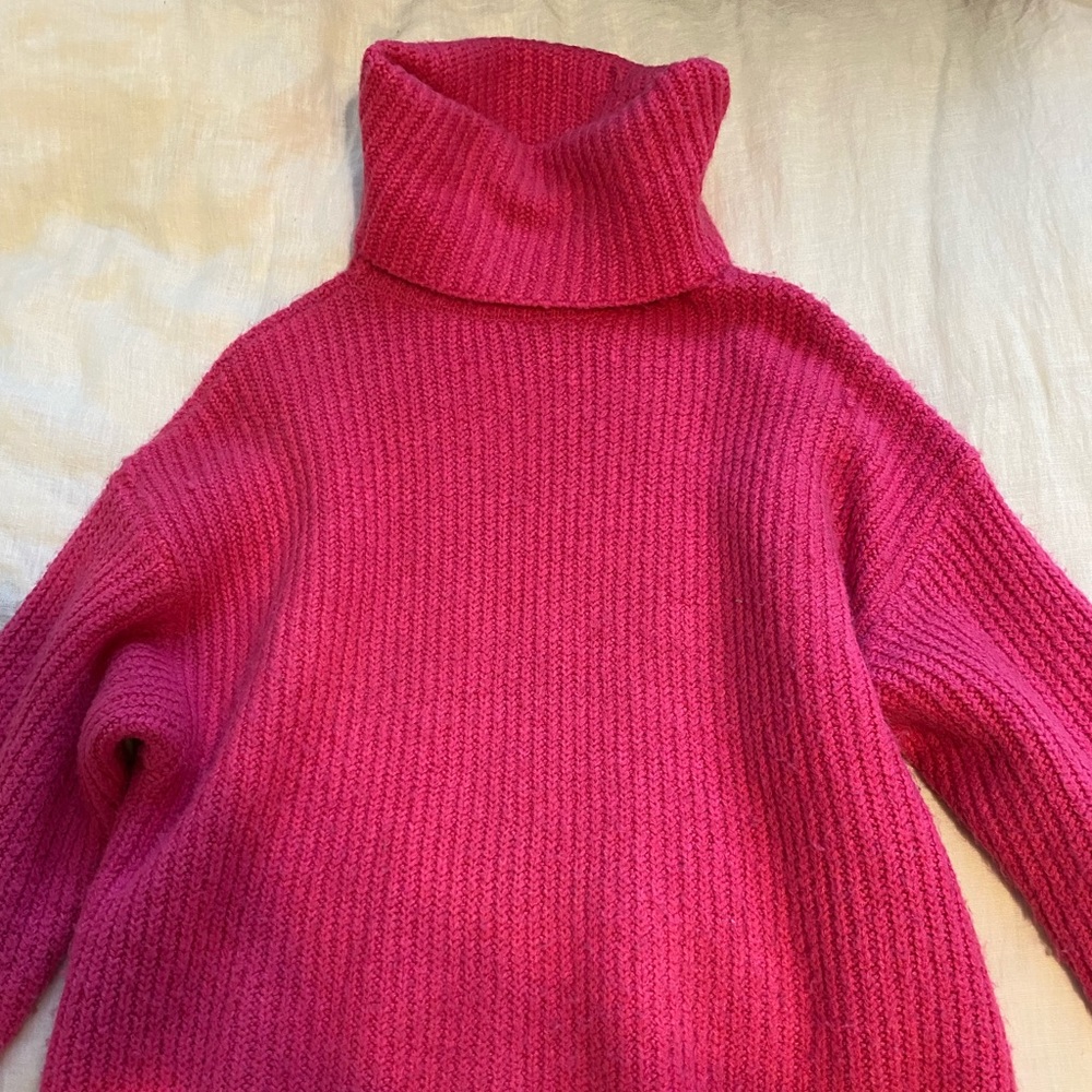 Pink oversized turtleneck sweater